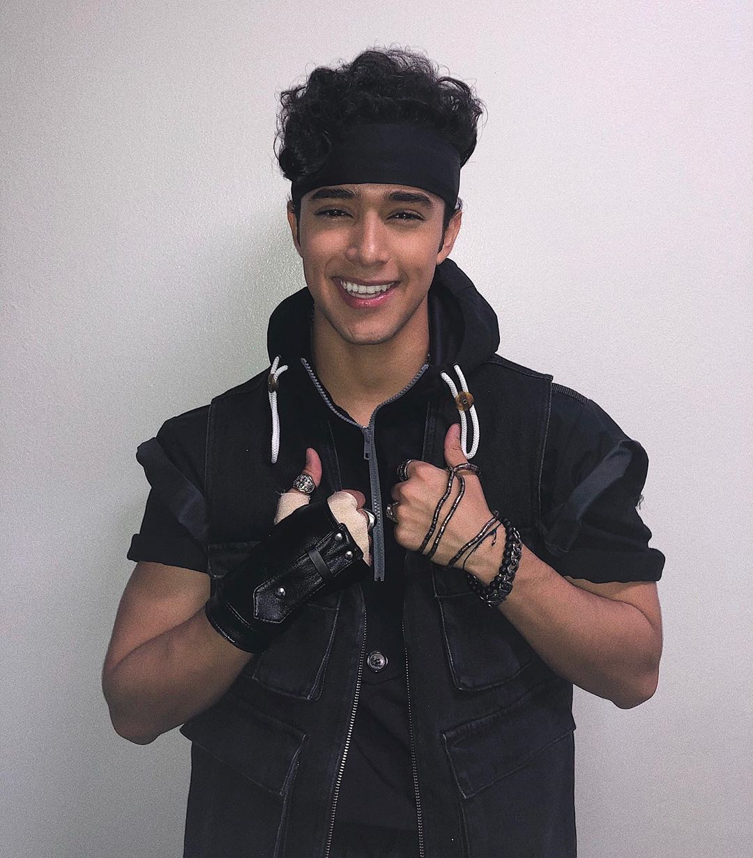 Joel Pimentel Wearing a Black Jacket and Gloves