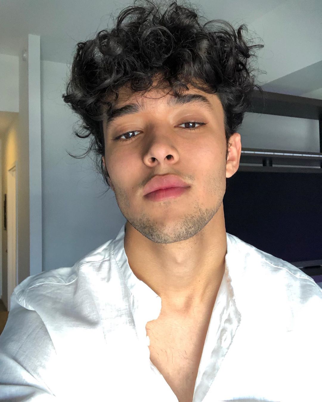 Joel Pimentel Wearing a White Shirt