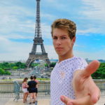 Ben Azelart Standing By the Eiffel Tower