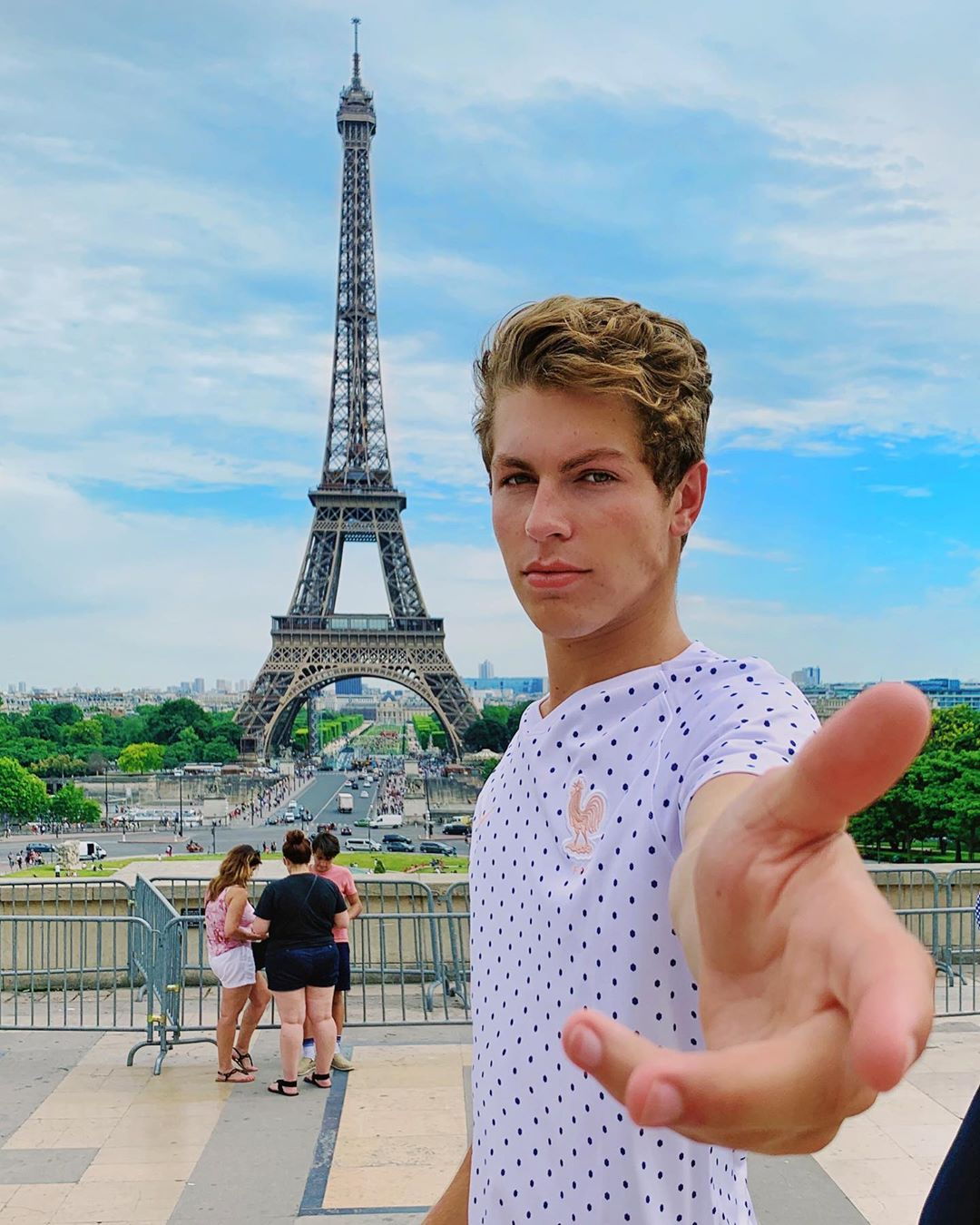 Ben Azelart Standing By the Eiffel Tower