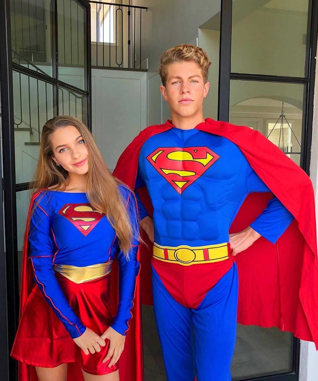 Ben Azelart Standing Beside Lexi Rivera in Superman Costumes